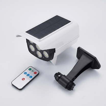 Inhoud van de doos: camera-lamp, montagebeugel en afstandsbediening